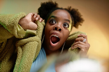 Surprised woman wearing faux fur coat