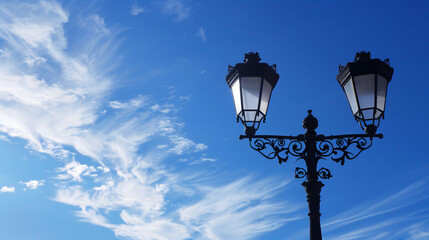 Fototapeta na wymiar Profile of a city lamp against a blue sky.