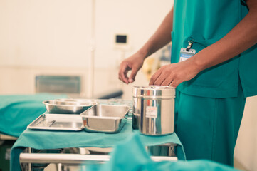 Medical students are preparing equipment to study surgery to treat sick people.