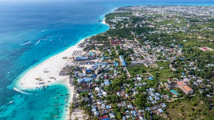 Fototapeten aerial landscape view of Kendwa a small village, located in the north part of Unguja Island, Zanzibar, with white sand strand of Kendwa Beach area  © Mario Hagen