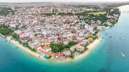 Abwaschbare Fototapete Zanzibar Aerial city view of area around the historic Stone Town, the oldest part of Zanzibar Town on Unjuja island, Tanzania with historic buildings and beaches 