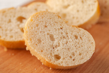 Fresh baked French baguette cut into slices