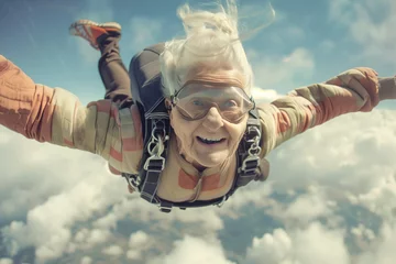 Papier Peint photo Ancien avion An old, elderly woman jumps from the parachute of an aeroplane and laughs with joy jolly old age