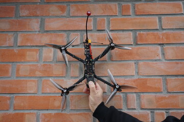 Holding FPV drone DIY fully assembled ready for a flight quadrocopter
