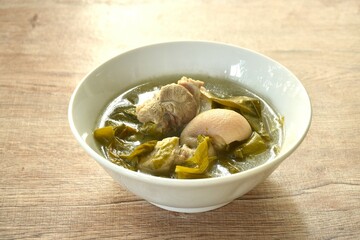 boiled pork leg and belly with cowa leaf soup on bowl