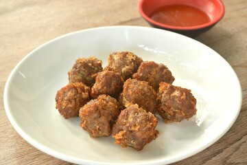 fried salt crispy chop pork with garlic dipping chili sauce on plate 