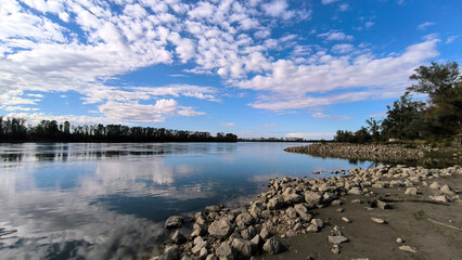 blue sky and white clouds reflected in Danube river in Vojvodina