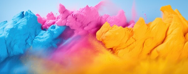 Colorful powder background, blue, yellow, pink. Holi powder.