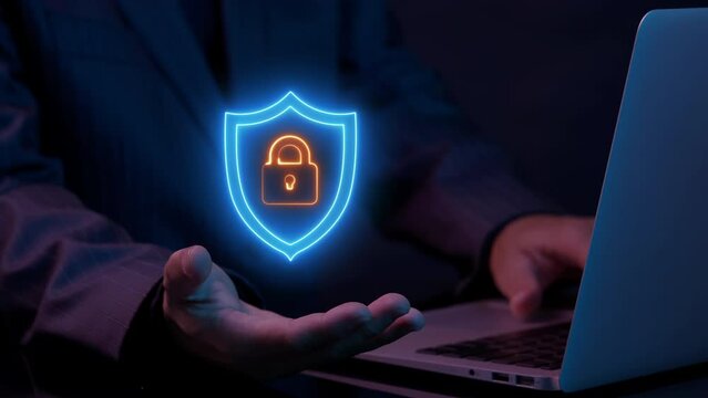 Businessman working with laptop that showing animation of padlock shield protective shield lock guard barrier icon. Secure service, protect data, internet safety, firewall system, privacy concept.