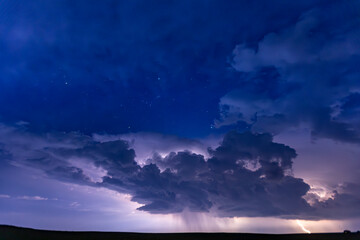 Lightning at night in a storm cloud