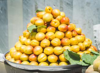 Juicy plums, peaches and apples at the Siab bazaar in the ancient city of Samarkand in Uzbekistan, nictarine at Siyob bozor