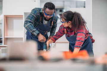 Experienced carpenter expertly drills precise holes, crafting furniture with practiced skill