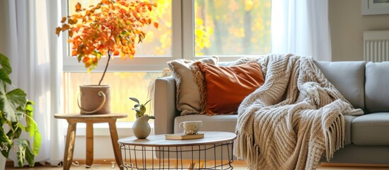 Autumn-themed cozy living room with still life objects represents leisure and weekends.