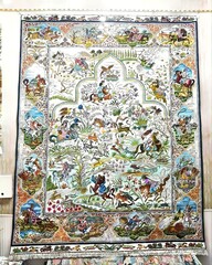 Traditional Persian rug with horses and animals