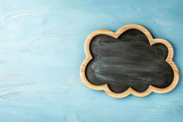 Blackboard in the shape of a cloud, concept of creativity, learning, light blue background.