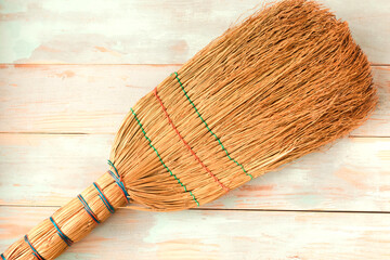 broom on wooden background. Spring cleaning concept.