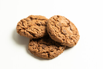 stack of dark chocolate cookies isolated on a white background