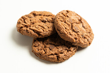 stack of dark chocolate cookies isolated on a white background