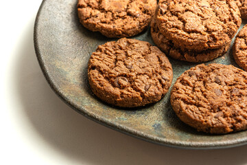 chocolate cookies on a dish isolated on a white background