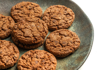chocolate cookies on a dish isolated on a white background
