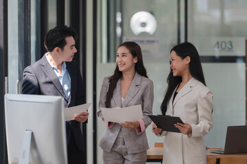 Businesswoman and businessman having a discussion together in the meeting room.