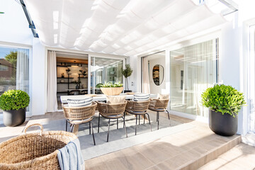 an image of a large luxury outdoor dining table in the back garden of a mediterranean mansion