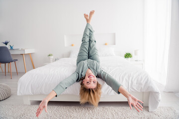 Full body size photo of young relaxed girl blonde hair model lying down ultra comfortable bed in her new flat apartment wearing pajama