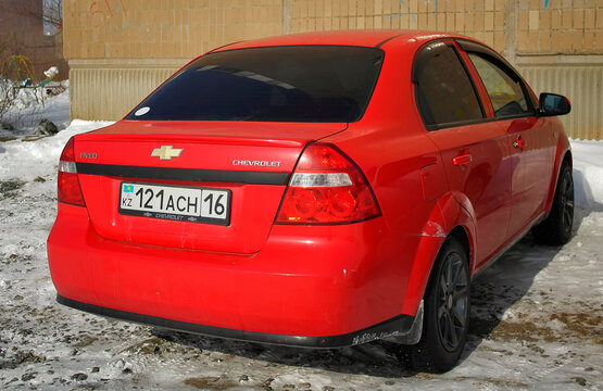 kazakhstan, Ust-Kamenogorsk, february 19, 2024: Chevrolet Aveo sedan T250. Economy compact sedan car. Bright Red Car
