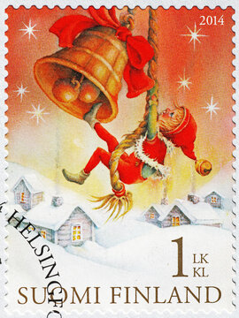 Boy ringing a bell in a finnish christmas stamp