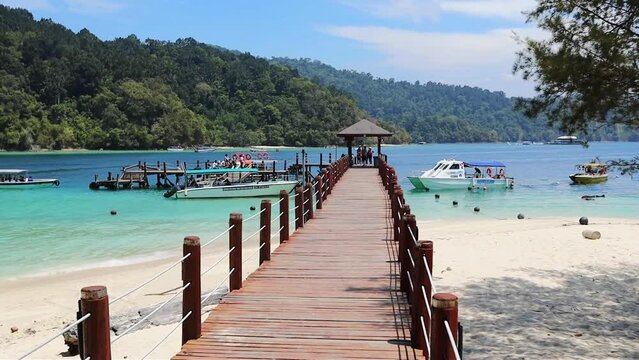 Wooden pier and boats at Sapi island KOta Kinabalu, Sabah, Malaysia