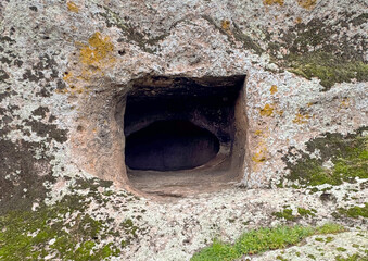 Fototapeta premium Domus de Janas necropolis Partulesi Ittireddu - fairy house, prehistoric stone structure typical of Sardinia 