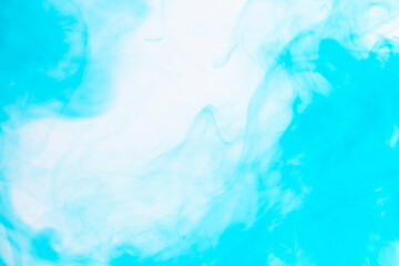 water soluble blue photograph There are patterns created by the flow of colors in the water.