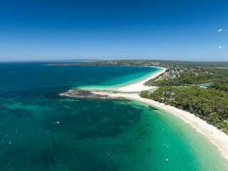 High angle aerial drone view of Huskisson Beach and Collingwood Beach in Huskisson and Vincentia, beachside suburbs in Jervis Bay Territory and on the South Coast of New South Wales, Australia.