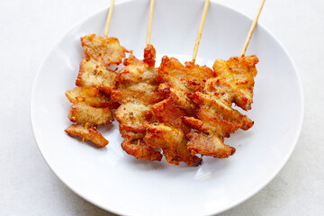 Fried pork on skewers. Delicious food
