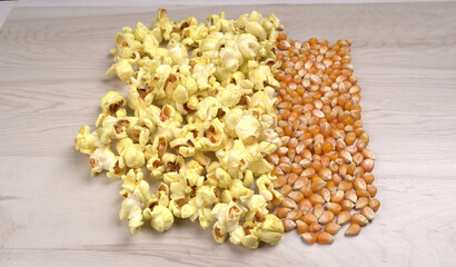 Caramel Popcorn is isolated on wooden background. Salted popcorn on the wooden table.