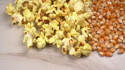 Caramel Popcorn is isolated on wooden background. Salted popcorn on the wooden table.
