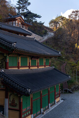 The exterior of Buddhist temple building on the autumn mountain