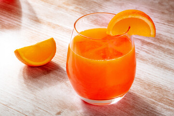 Orange drink on a wooden background, fresh pressed juice with fruit slices - 746528557