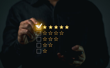 Customer Giving Five Star Rating Review. Businessman in dark shirt digitally selecting a five-star rating, symbolizing high customer satisfaction and quality service.