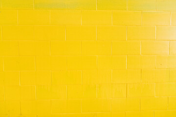 Background of yellow painted bricks wall, Tuscany in Italy