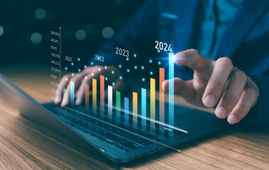 2024 business financial plan market concept, performance of profit growth on 2023 to 2024, education trend up finance on growth graph money revenue, Businessman analyzes profitability of working. - obrazy, fototapety, plakaty