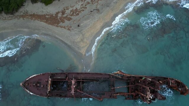 Valtaki Beach, Peloponnese, Greece - 02-27- 2024  Dimitrios Shipwreck on Paralia Glyfada, Peloponnese , near Gytheio, Gythio RUSTY WRECK ABANDONED ON THE SEA SHORE ON THE BEACH AFTER SHIPWRECK