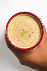 hand holding a cup of coffee