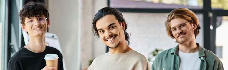 young men in their 20s with coffee in a friendly office atmosphere, professional headshot banner