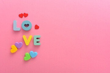 Letter LOVE on a pink white background