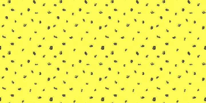 Dash pattern on yellow background. Wrapping paper with small black dots painted with a brush. Seamless simple minimal ornament. Abstract geometric grunge vector texture painted by ink.