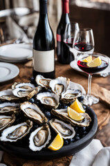 Oysters on a Plate with Lemon and Wine Pairing
