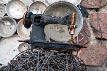 The ‘pan house’ (‘puodu namas’) is covered with pots and pans of all shapes and sizes, closeup view