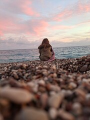 person sitting on the beach