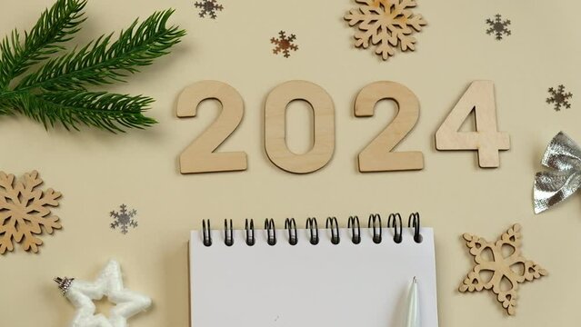 New Year Aims 2024 To Do List Empty Notebook at the Desk with Holiday Decoration Top View Creating